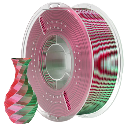 Spool of red and green filament with a sample model